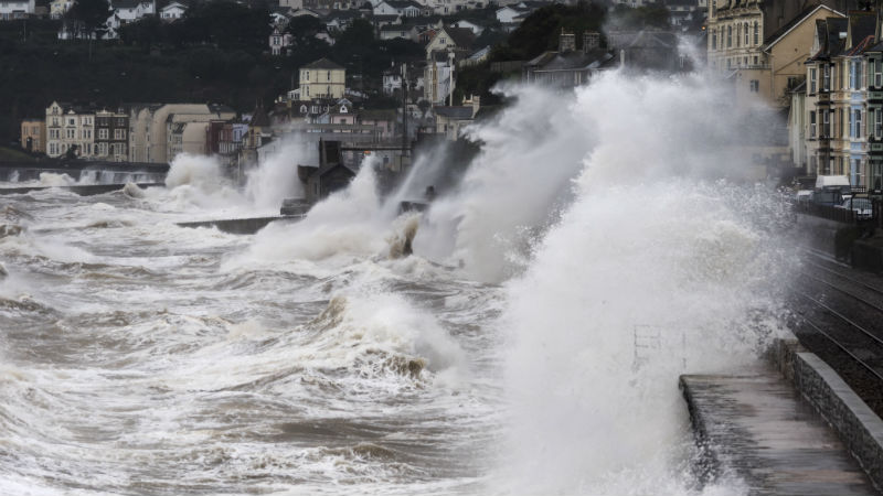 Waves crashing against sea wall in Dawlish