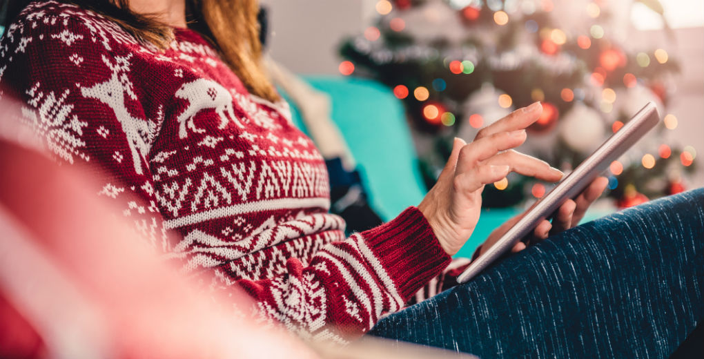 Woman shopping online at christmas to reflect cyber insurance in Northumberland and Newcastle